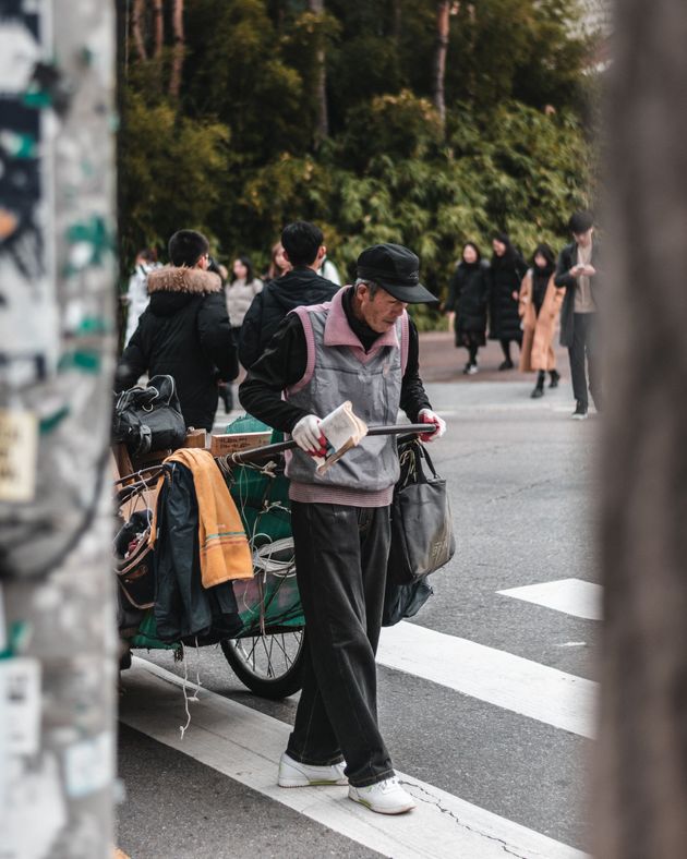 When elderly are in financial distress and abandoned by their children, they find revenue by gathering and selling cardboard. This man seemed OK, but I encountered grandmas so old they could barely stand on their feet. It's a heartbreaking reality.